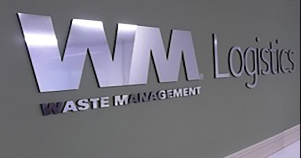Logo d'une entreprise en alu collé sur le mur